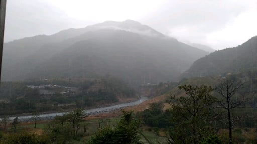 Fog-covered valley road in Uttarakhand