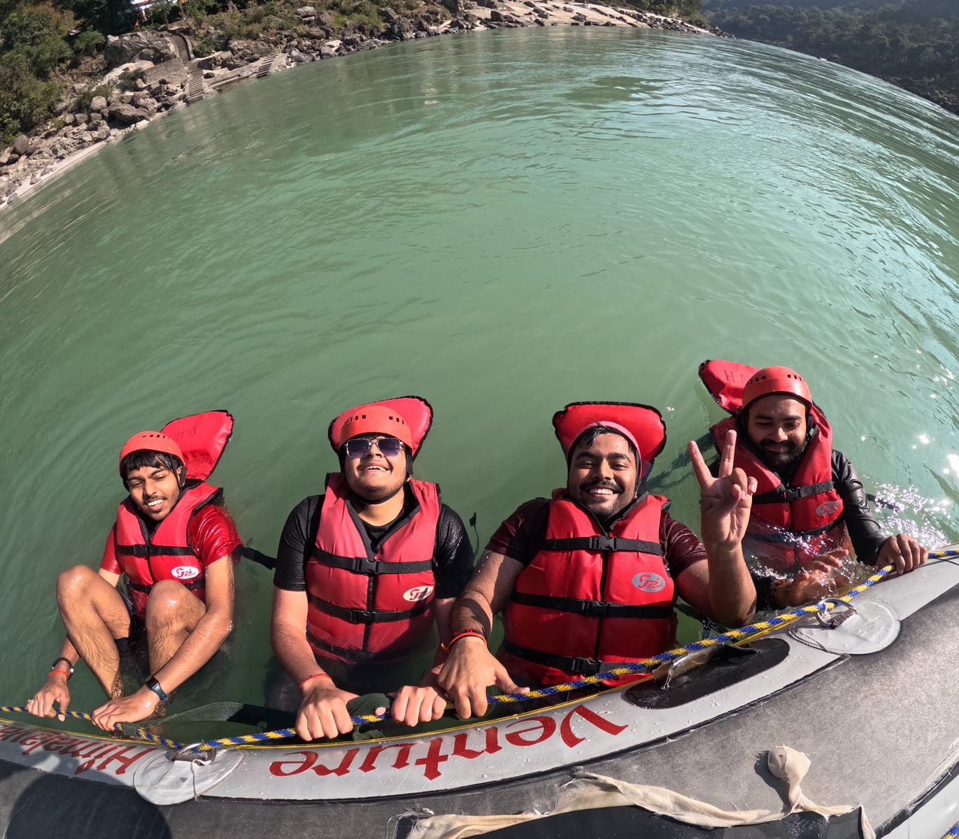 Group seated in a raft on the Ganga in Rishikesh