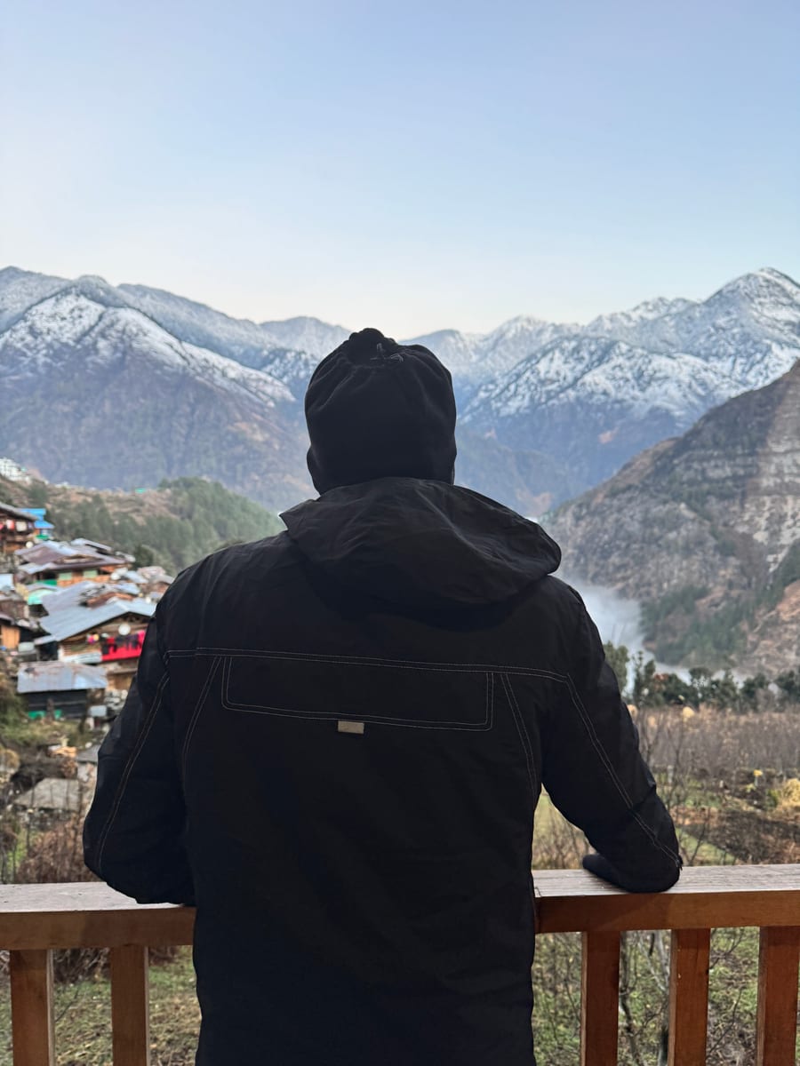 Snow-covered mountain village view near Sankri